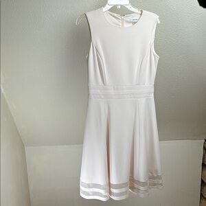 Calvin Klein Fit and Flair dress. Pale Pink. Size 8. Cute Peek-a-boo hemline.